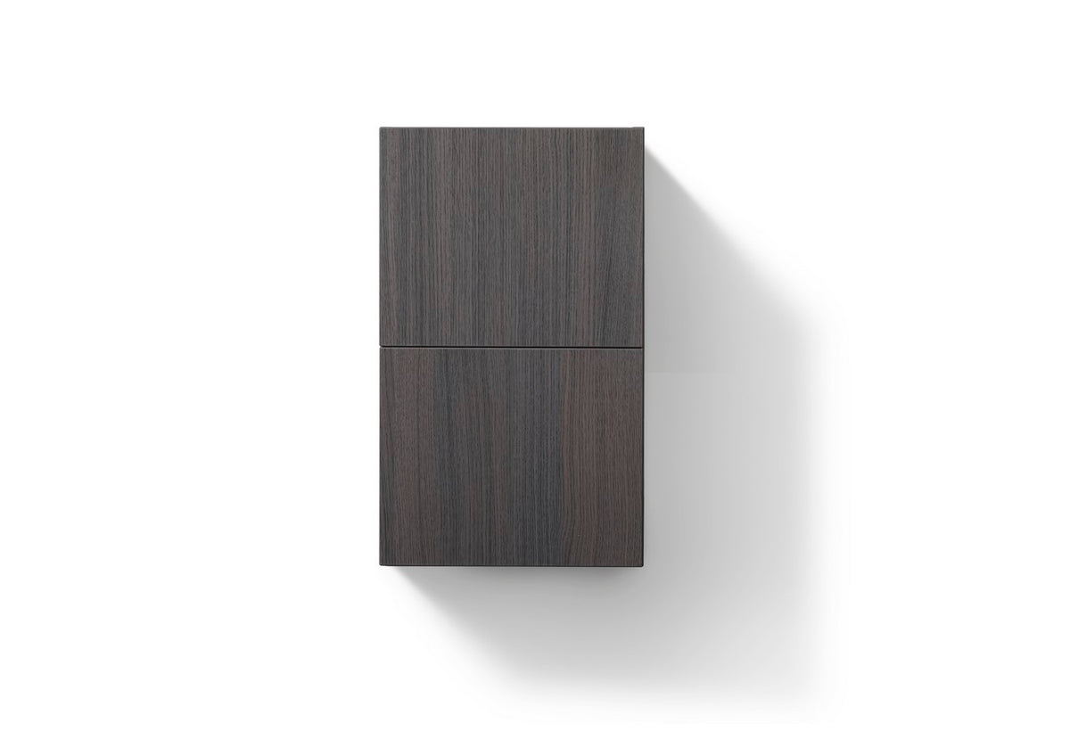 A gray oak bathroom linen side cabinet with a closed door, featuring a sleek modern design.