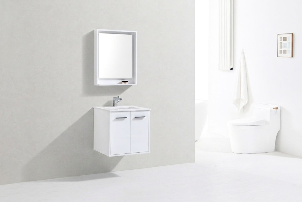Bathroom setup with a white vanity, mirror, and toilet against a light gray wall.