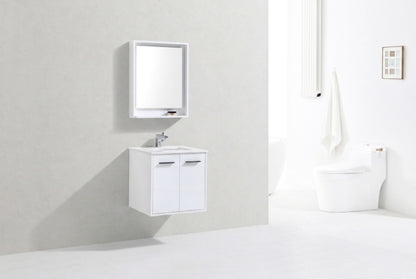 Bathroom setup with a white vanity, mirror, and toilet against a light gray wall.