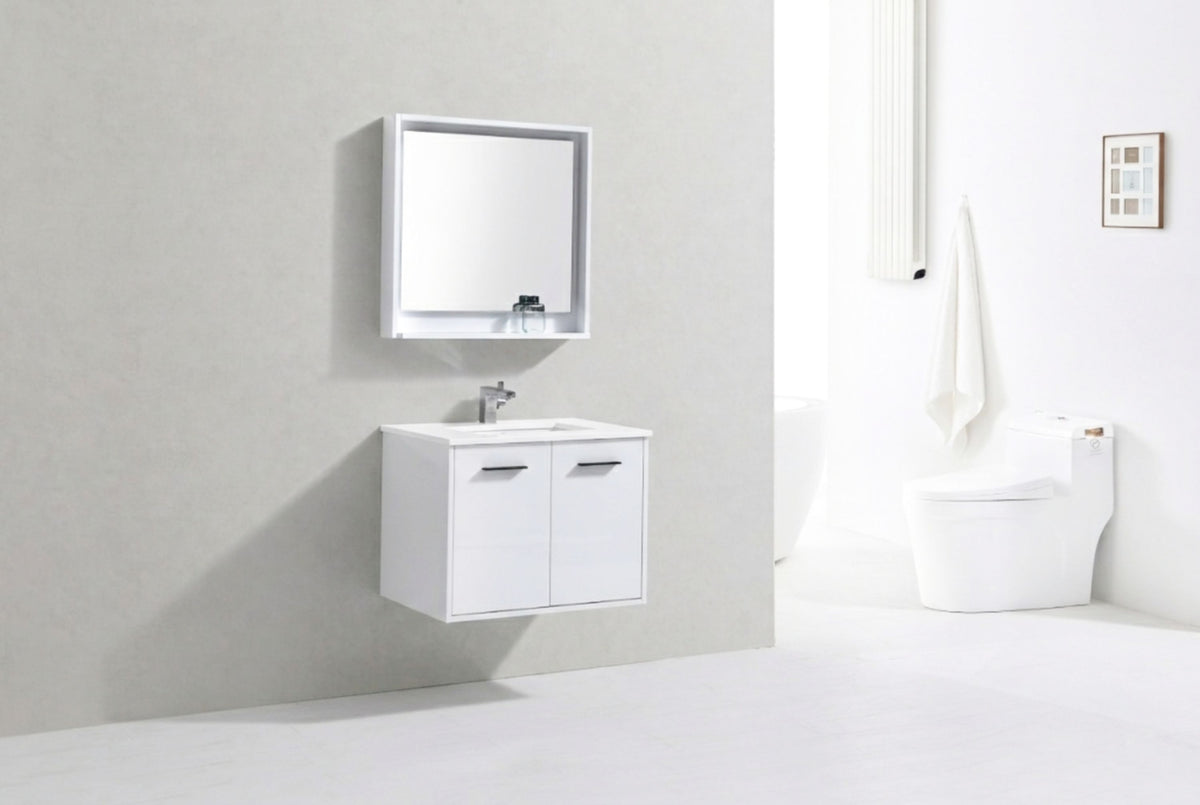 Modern bathroom with white vanity, mirror, and toilet against a light gray wall.