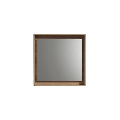 A rectangular mirror with a honey oak frame and shelf below it.