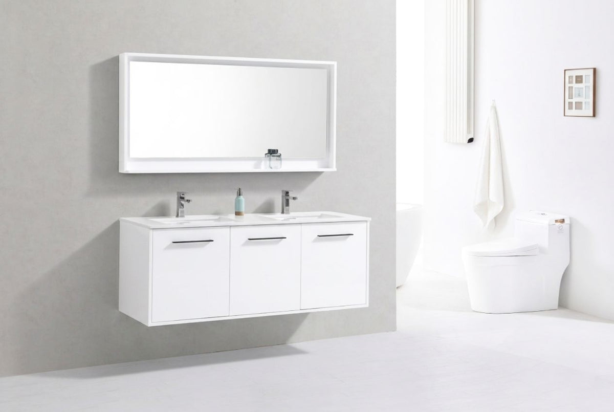 Modern bathroom with white vanity, mirror, and toilet.