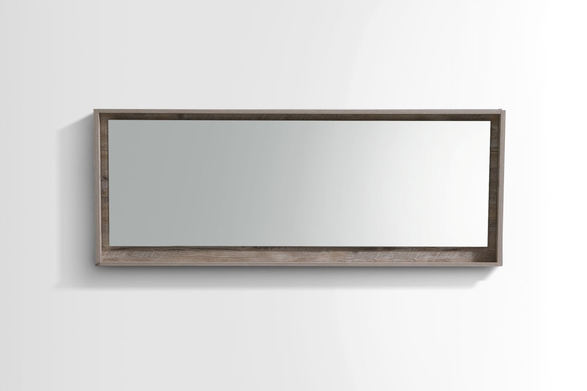 A 70 inch wide mirror with a nature wood frame and shelf below.