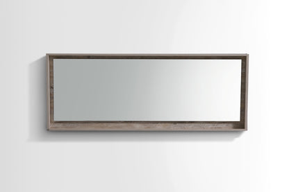 A 70 inch wide mirror with a nature wood frame and shelf below.
